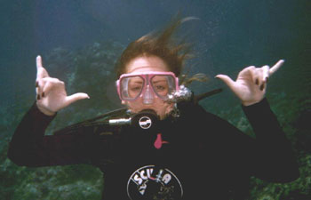 Shawna throwing a double shaka off sandy neck